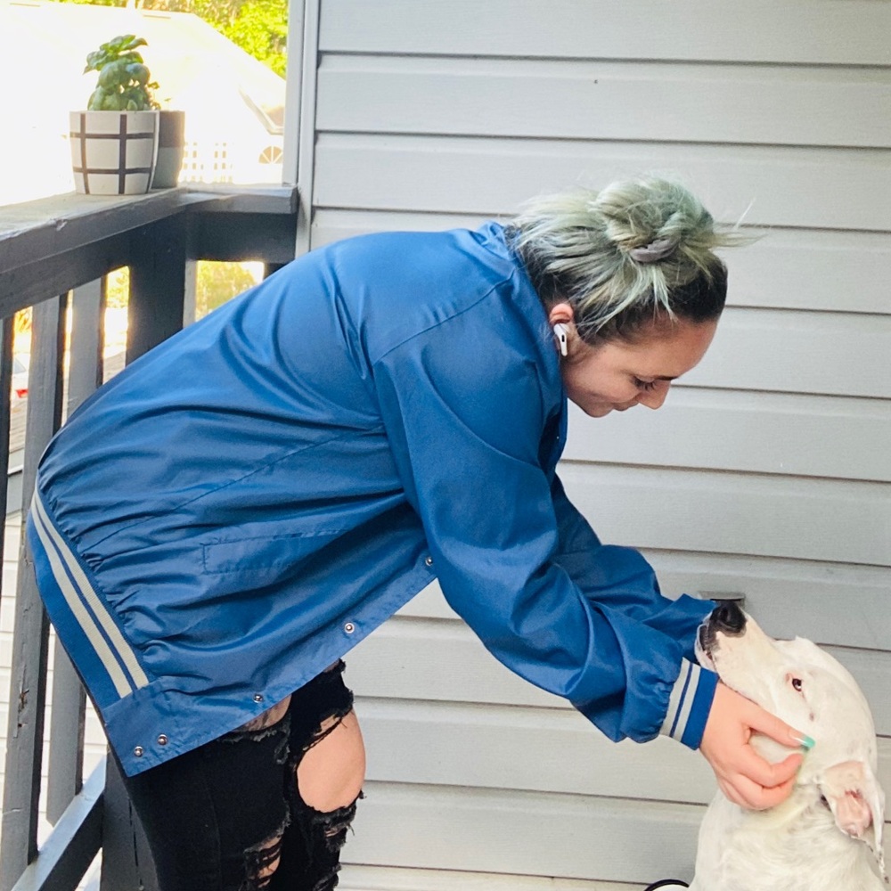 Blue snap up jacket with white striped lining